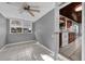 Living room with tile floors, kitchen view, and ceiling fan at 919 Ferndell Rd, Orlando, FL 32808