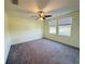 Bright bedroom featuring two windows and ceiling fan at 10118 Storey Grove Way, Winter Garden, FL 34787