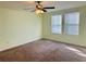 Spacious bedroom with neutral carpeting and window blinds at 10118 Storey Grove Way, Winter Garden, FL 34787