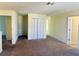 Bright hallway with neutral carpeting and multiple doors at 10118 Storey Grove Way, Winter Garden, FL 34787