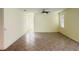 Spacious living room with tile flooring and ceiling fan at 10118 Storey Grove Way, Winter Garden, FL 34787