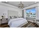 Spacious bedroom with a large bed, nightstands, and window at 1104 Western Blue Way, Minneola, FL 34715