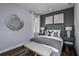 Cozy bedroom featuring a comfortable bed, stylish decor, and ample natural light at 1104 Western Blue Way, Minneola, FL 34715