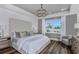 Main bedroom with a large bed, wood floors, and plenty of natural light at 1104 Western Blue Way, Minneola, FL 34715