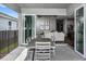 Outdoor patio with sliding glass doors leading to living room at 1104 Western Blue Way, Minneola, FL 34715