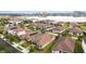 Aerial view of house and neighborhood with lake view at 11637 Meadow Grove Cir, Orlando, FL 32836