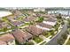 Aerial view of a home in a community with lake access at 11637 Meadow Grove Cir, Orlando, FL 32836