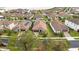 Luxury homes with tile roofs and lush green lawns at 11637 Meadow Grove Cir, Orlando, FL 32836