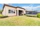 Large backyard with a covered patio and trampoline at 11637 Meadow Grove Cir, Orlando, FL 32836