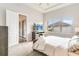 Main bedroom with ensuite bathroom access and TV at 11637 Meadow Grove Cir, Orlando, FL 32836