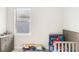 bedroom with a crib and dresser at 11637 Meadow Grove Cir, Orlando, FL 32836