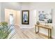 Bright and spacious entryway with wood-look floors and stylish decor at 11637 Meadow Grove Cir, Orlando, FL 32836