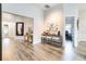 Spacious foyer with a console table, mirror, and hardwood floors at 11637 Meadow Grove Cir, Orlando, FL 32836