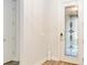 Bright entryway with a glass door and wood-look flooring at 11637 Meadow Grove Cir, Orlando, FL 32836