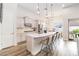 Open concept kitchen with large island and stainless steel appliances at 11637 Meadow Grove Cir, Orlando, FL 32836