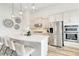 Modern kitchen with large island and stainless steel appliances at 11637 Meadow Grove Cir, Orlando, FL 32836