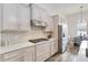 Modern kitchen with stainless steel appliances and white cabinets at 11637 Meadow Grove Cir, Orlando, FL 32836