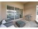 Covered patio with seating area and access to the kitchen at 11637 Meadow Grove Cir, Orlando, FL 32836