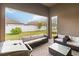 Covered patio with seating area and grill at 11637 Meadow Grove Cir, Orlando, FL 32836