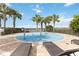 splash pad with lounge chairs near the lake at 11637 Meadow Grove Cir, Orlando, FL 32836