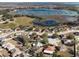 Aerial view of residential neighborhood near a lake at 1311 Plover Ct, Groveland, FL 34736