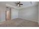 Bright bedroom with ceiling fan and carpet flooring at 14537 Golden Harbor Ln, Winter Garden, FL 34787