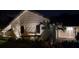 Night view of charming home with beautiful landscaping at 1860 Linden Rd, Winter Park, FL 32792