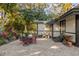 Outdoor patio with seating area and lush landscaping at 304 Hermits Trl, Altamonte Springs, FL 32701