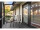 Relaxing screened porch with two chairs, offering views of the backyard at 304 Hermits Trl, Altamonte Springs, FL 32701