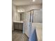 Modern bathroom with gray vanity and walk-in shower at 3509 Yarian Dr, Haines City, FL 33844