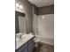 Clean bathroom with tub, shower, and vanity at 3509 Yarian Dr, Haines City, FL 33844