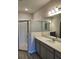 Elegant bathroom featuring a double vanity and shower at 3509 Yarian Dr, Haines City, FL 33844