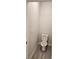 Simple toilet and neutral walls in a small bathroom at 3509 Yarian Dr, Haines City, FL 33844