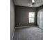 Bedroom featuring gray walls, carpet, and window at 3509 Yarian Dr, Haines City, FL 33844