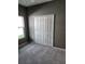 Bedroom with double door closet and grey walls at 3509 Yarian Dr, Haines City, FL 33844