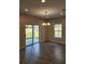 Dining area with sliding glass doors and chandelier at 3509 Yarian Dr, Haines City, FL 33844