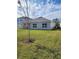 View of the back of the house and yard at 3509 Yarian Dr, Haines City, FL 33844