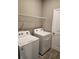 Laundry room with washer, dryer, and shelving at 3509 Yarian Dr, Haines City, FL 33844