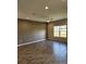 Living room with dark tile flooring and accent wall at 3509 Yarian Dr, Haines City, FL 33844