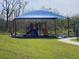 Community playground with shaded play area and slides at 3509 Yarian Dr, Haines City, FL 33844