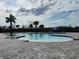 Community pool with brick pavers and palm trees at 3509 Yarian Dr, Haines City, FL 33844