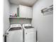 Laundry room with washer, dryer, and cabinets at 440 Burnham Cir, Auburndale, FL 33823