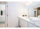 Simple bathroom with white vanity and mirror at 664 Benoi Dr, Davenport, FL 33896