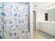 Bathroom with seashell-themed shower curtain at 664 Benoi Dr, Davenport, FL 33896