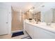 Spa-like bathroom with double vanity and shower at 664 Benoi Dr, Davenport, FL 33896
