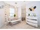 Elegant dining area with white table and geometric wallpaper at 664 Benoi Dr, Davenport, FL 33896