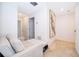 Upstairs hallway with large artwork and seating at 664 Benoi Dr, Davenport, FL 33896