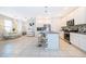 Modern kitchen with white cabinetry, granite counters and island at 664 Benoi Dr, Davenport, FL 33896