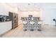 Modern kitchen with stainless steel appliances and an island at 664 Benoi Dr, Davenport, FL 33896