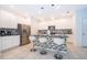 Modern kitchen with stainless steel appliances and an island at 664 Benoi Dr, Davenport, FL 33896